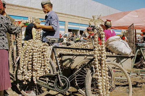 Garlic vendor at bazaar in Uyghur, China