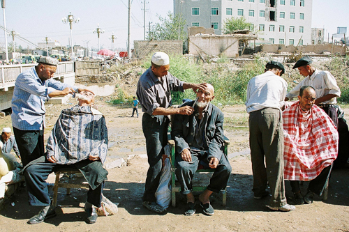 Barber at bazaar in Uyghur, China